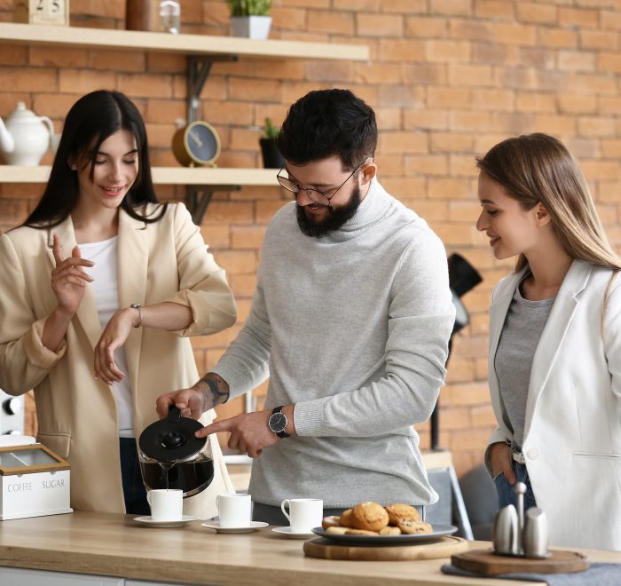 People having coffee break In office