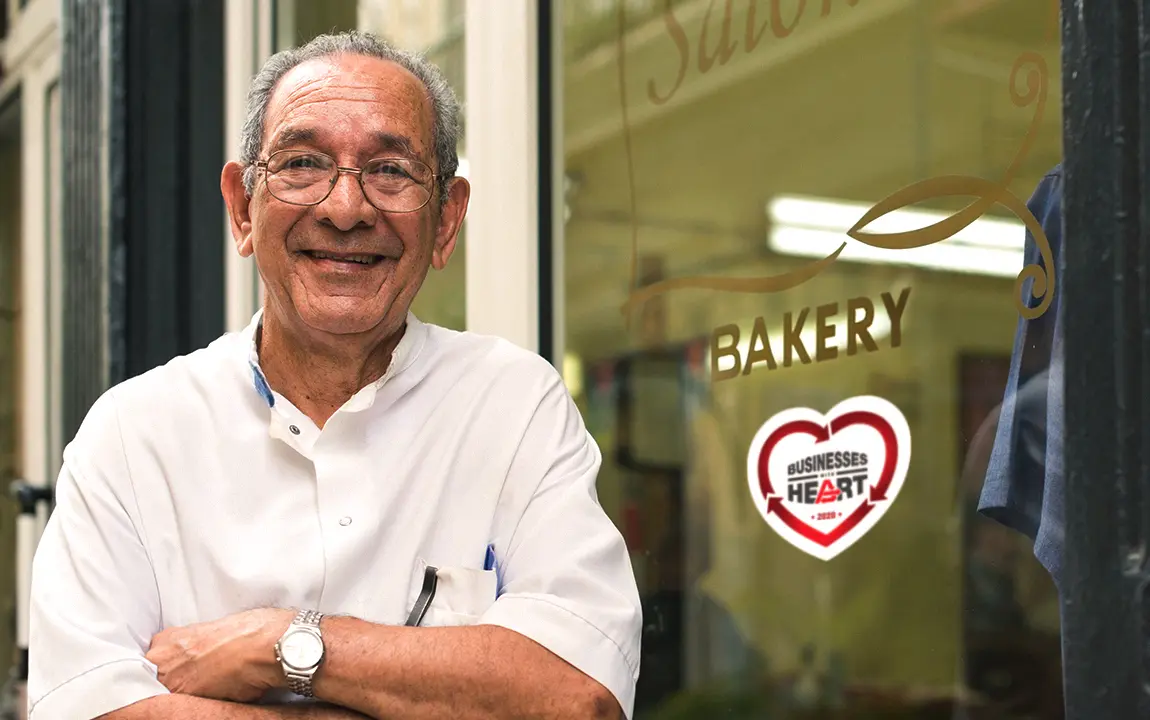 Man Standing In front of barkery shop with arms crossed