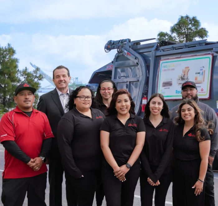 Thumbnail of Athens Services Team Members Standing Infront Of Front Loader Trash Truck In San Pedro
