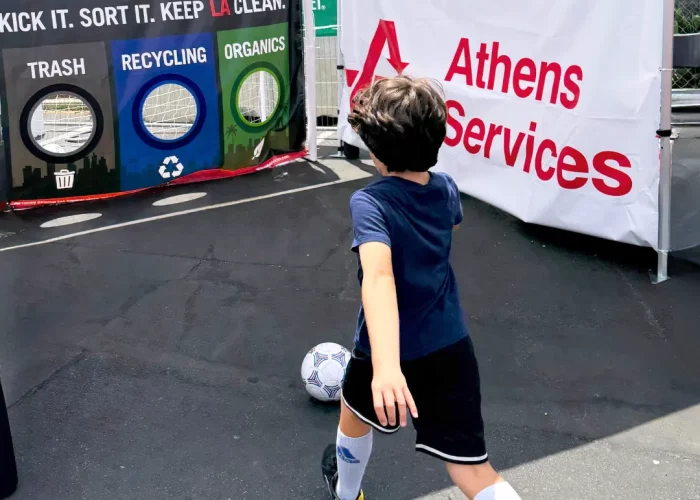 Boy kicking soccer ball